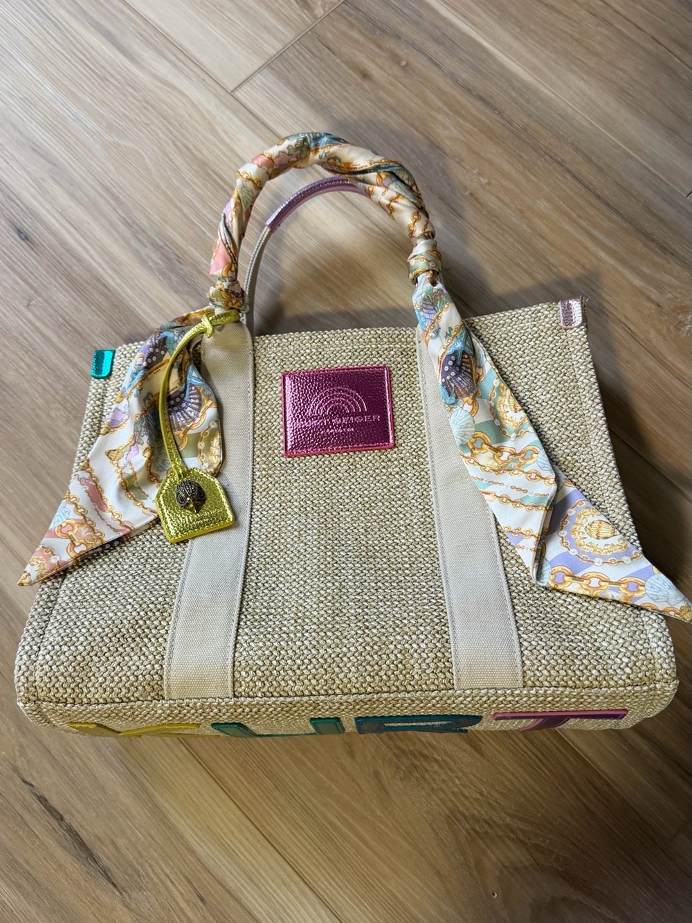 Kurt Geiger Neutral Straw Tote with Pink Logo Patch and Pastel Scarf